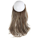 Back view of a medium-long hairpiece with brown roots and light blonde highlights, attached to a round top cap, shown on a white background.