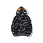 Dark grey camo zip-up hoodie with graphic eye details on the hood and ribbed cuffs and hem.