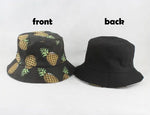 Black bucket hat displayed on a wire stand, with a yellow patch reading “HAVE A GOOD DAY” on the front and white numbers printed around the brim.