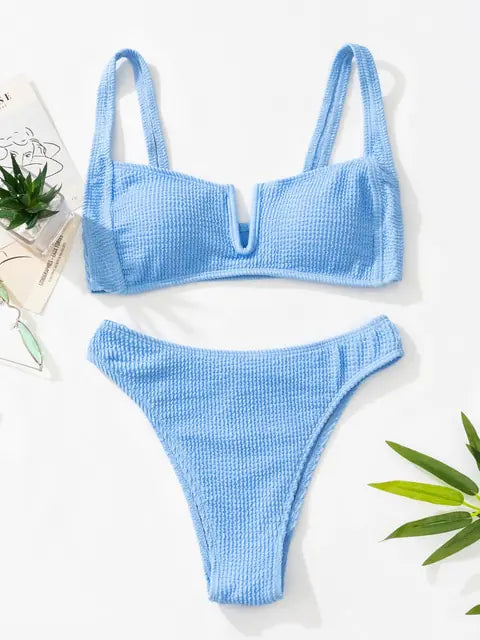 Light blue textured bikini set with a wide-strap bandeau-style top featuring a front U-wire detail and matching high-cut bikini bottoms.