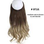 Long, wavy light-brown hair extension piece with a U-shaped opening at the top, shown against a white background.