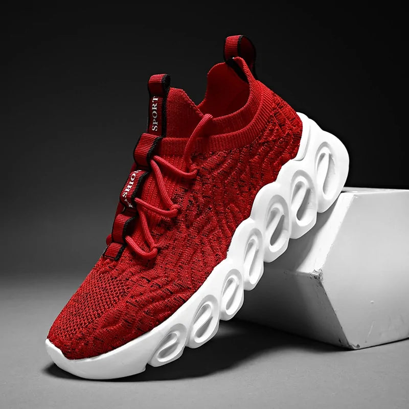 Red knit sneaker with lace-up closure and a chunky white hollow sole.