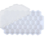 White silicone ice cube tray with a honeycomb pattern of hexagonal compartments, shown on a white background.