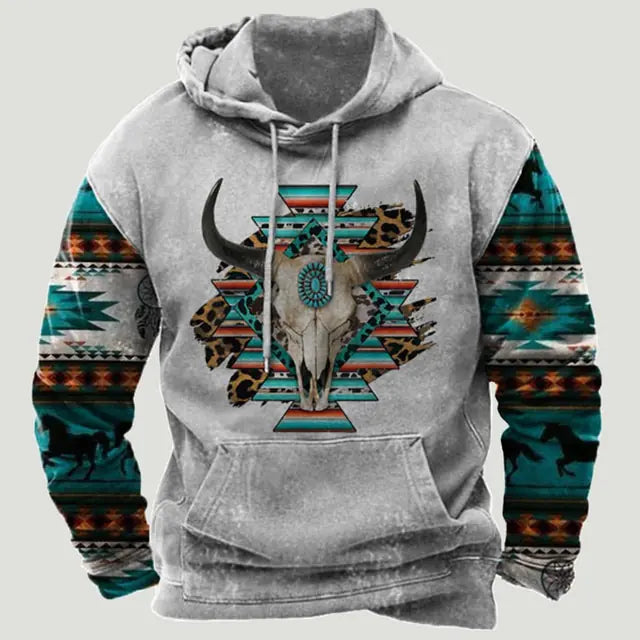 Gray pullover hoodie with drawstrings and a kangaroo pocket, featuring a bull skull graphic over turquoise geometric patterns; sleeves have multicolor Southwestern-style print accents.