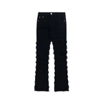 Brief alt text: Black distressed straight-leg jeans with frayed seams and raw hems.