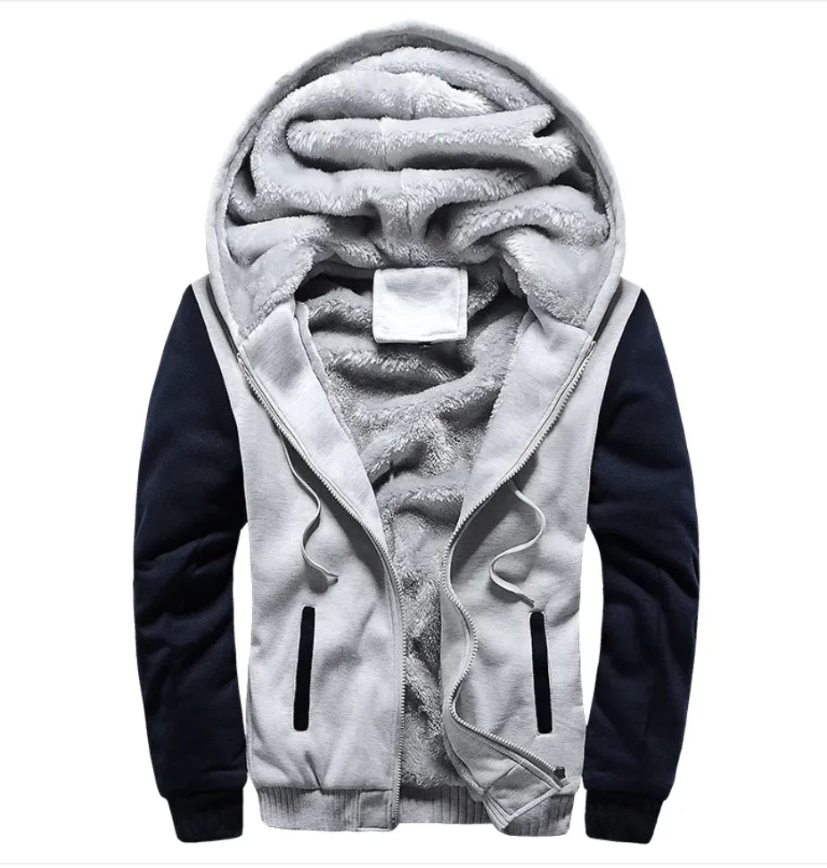 A stylish two-tone hoodie with a navy blue body and red sleeves, featuring a thick, plush gray fleece lining for warmth. The hood is large and lined with the same soft material, and the jacket includes a full-length zipper and two front pockets with red accents. Designed for cold weather comfort.