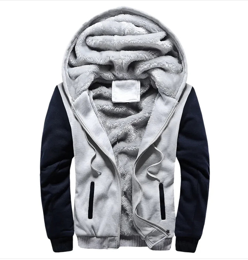 A stylish two-tone hoodie with a navy blue body and red sleeves, featuring a thick, plush gray fleece lining for warmth. The hood is large and lined with the same soft material, and the jacket includes a full-length zipper and two front pockets with red accents. Designed for cold weather comfort.