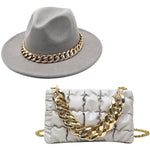 Grey fedora hat and quilted handbag set with chunky gold chain details.