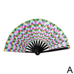 Open folding hand fan with black ribs and a bright rainbow, radiating geometric pattern, shown on a white background.
