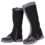 Black waterproof hiking gaiters over walking shoes.

