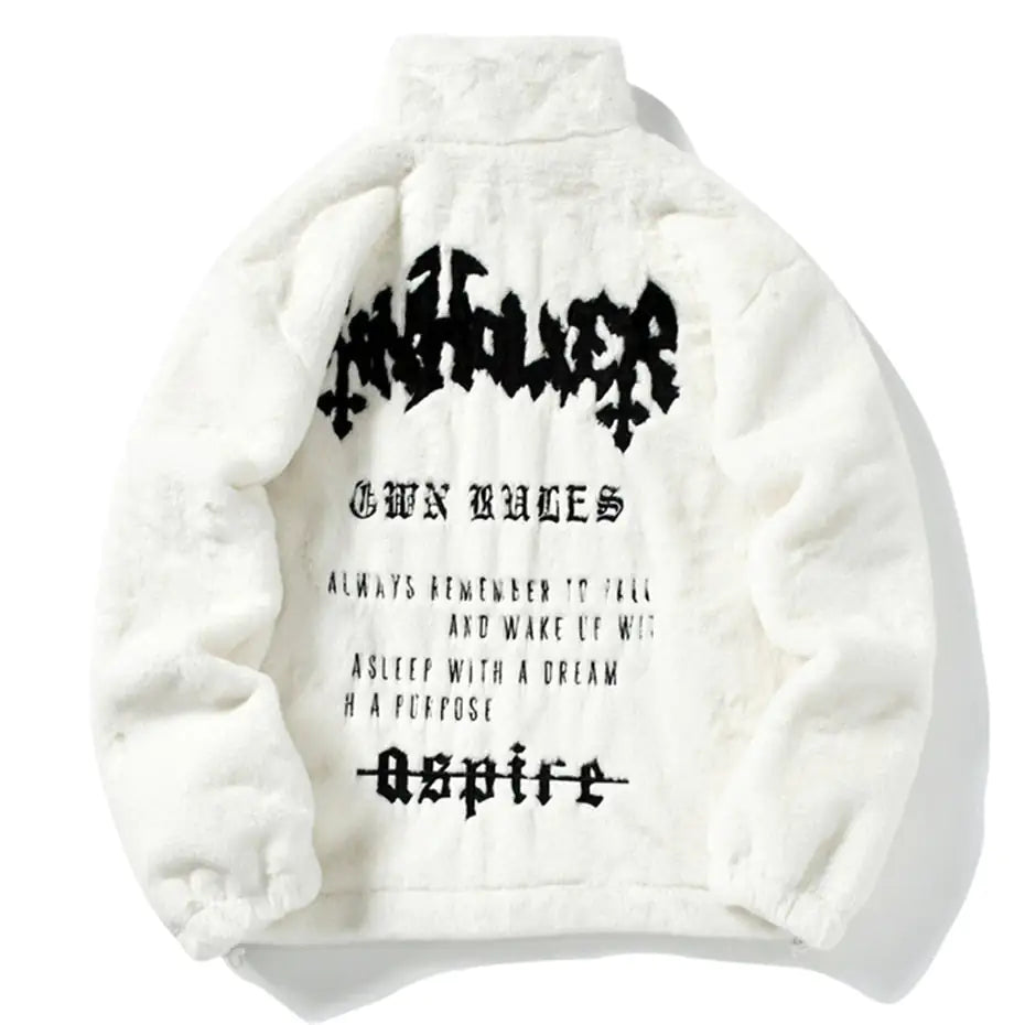 White fluffy fleece jacket with black graphic print.
