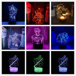 A collection of images showing a 3D LED illusion night light with an anime character design. The night light is illuminated in various colors, and the images display the lamp in different settings, such as on a table and in a dark room, highlighting its use as a night light.