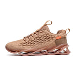 Tan athletic trainers with a textured knit upper, pull tabs and sculpted cushioned sole.
