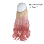 Long wavy hair extensions with a gradient color, transitioning from beach blonde at the roots to pink at the tips.