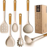 Kitchen utensil set with white silicone tools and wooden handles—slotted turner, spoon, ladle, pasta server, skimmer, and spatula—displayed beside a box labeled “6.”