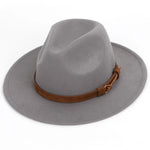 A light gray wide-brim fedora-style hat with a soft, structured crown and a brown leather band wrapped around the base. The hat is shown against a plain white background.