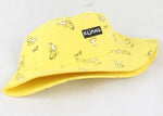 Yellow bucket hat with small banana illustrations and a “KUNG” label on the front, shown on a white background.