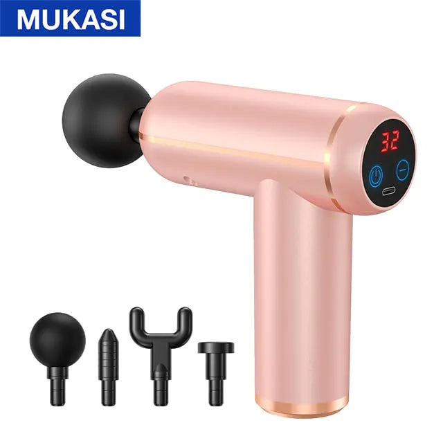 A pink MUKASI handheld massage gun with a black round massage head and a digital display showing “32,” pictured with four interchangeable attachment heads on a white background.