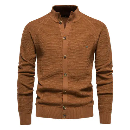 A sophisticated knitted cardigan with a mandarin collar and a button-up front. The cardigan features a textured pattern, ribbed cuffs and hem, and brown-toned buttons that add a stylish contrast. A small embroidered logo is visible on the left chest, enhancing its elegant design