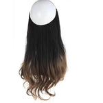 Three bundles of long, straight black hair extensions laid side by side on a white background, each tied at the top with a small band.