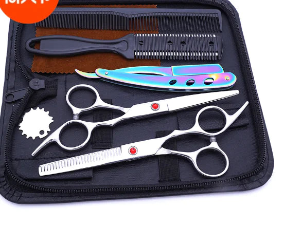Haircutting tool kit in a zippered case, including two silver hair scissors (one thinning shears), a black comb, and a rainbow-finish straight razor, arranged on a black interior.