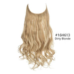 A product photo of a U-shaped “halo”/wire hair extension piece. The hair is long with loose waves and curls toward the ends. The color is a multi-tonal dirty blonde with darker, slightly ashy roots blending into lighter blonde lengths. Text on the right reads “#16H613 Dirty Blonde