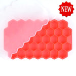 Red honeycomb-style silicone ice cube tray with hexagonal compartments, shown with a translucent lid partially covering it and a “NEW” badge in the corner.