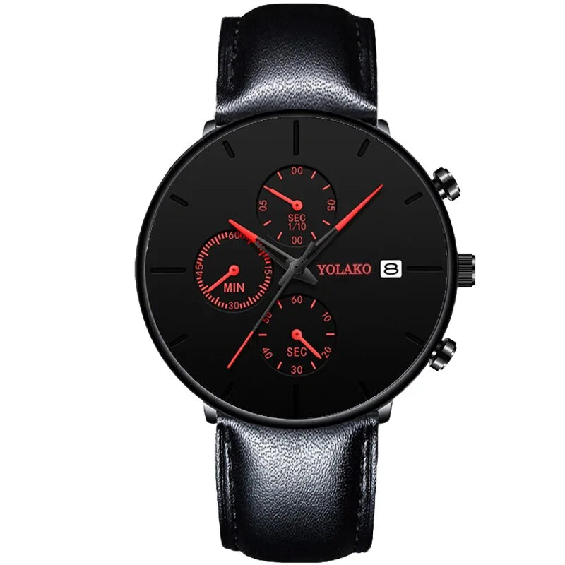 Black analog wristwatch with a black leather strap, red hands and subdials, and a date window, shown on a white background.