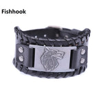 Black braided leather wristband bracelet with metal snaps and a rectangular silver-tone plate engraved with a stylized wolf head, labeled “Fishhook,” on a white background.