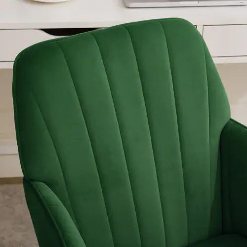 Green office chair with quilted design on a blurred background