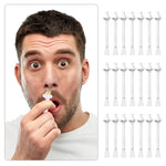Man holding a toothbrush head with multiple toothbrush heads displayed on a white background