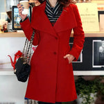 Woman wearing a stylish deep red long-sleeve mini dress with a sweetheart neckline, layered ruffle skirt, and puffed sleeves, posing with one hand on her waist