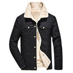 A black long-sleeve jacket with a warm cream sherpa lining and matching oversized sherpa collar. It features a button-front closure, flap chest pockets with metal buttons, side pockets, and a structured casual fit. The contrast between the dark outer shell and soft inner lining gives it a rugged yet cozy cold-weather look.