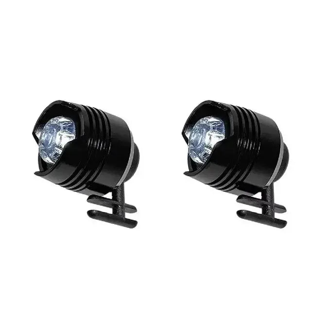 Two small black cylindrical LED bike light with a clear front lens, mounted on a black rubber strap, on a white background.