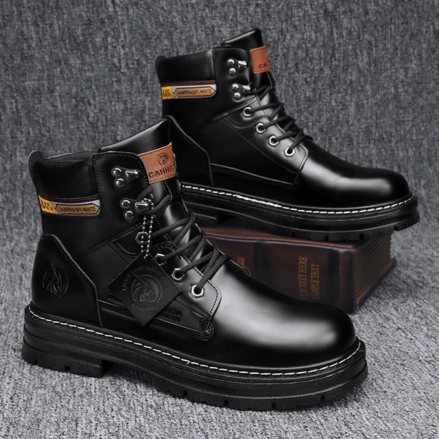 A pair of tan high-top boots with a thick jute-wrapped sole and colorful teddy bear patchwork fabric on the sides. The boots have a rugged design with metal eyelets and a branded patch on the side, displayed against a warm brown background.