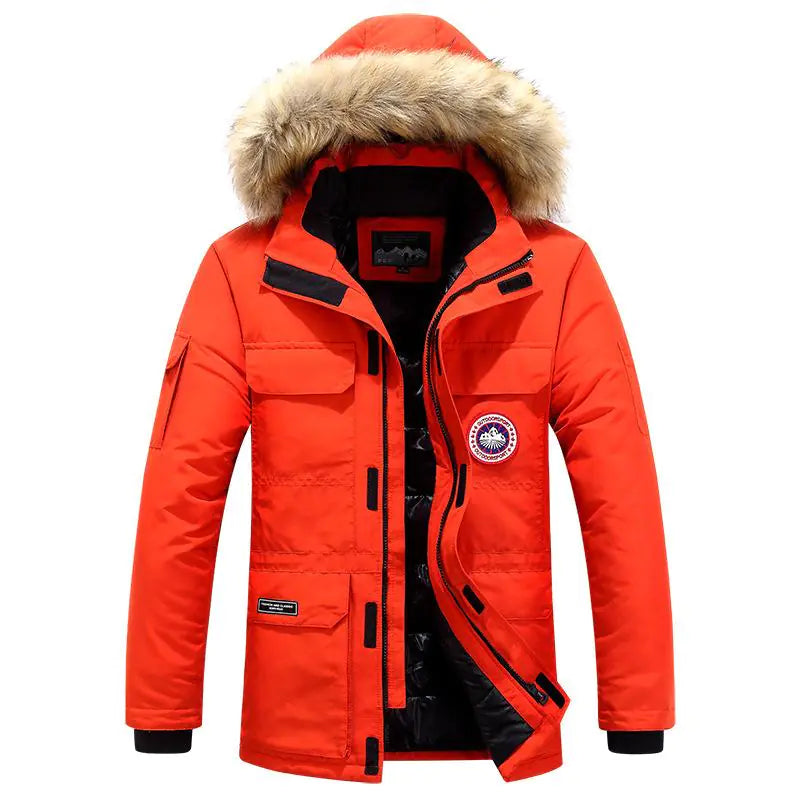Bright red insulated parka with a fur-trimmed hood, multiple front pockets, and a round chest patch, shown on a white background.

