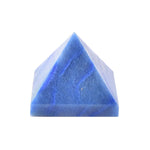 Small blue pyramid-shaped crystal or stone with subtle marbled patterns, photographed on a white background.