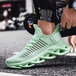 Mint green knitted trainers with hollow cushioned soles.