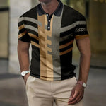 Man wearing a short-sleeve polo shirt with a black collar and bold geometric stripes in black, tan, and gray, paired with beige trousers and wristwatches, standing outdoors.