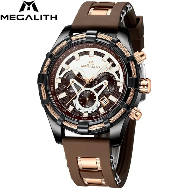 A close-up product photo of a MEGALITH men’s chronograph wristwatch with a black case, brown silicone strap, and rose-gold accents. The white and brown dial features multiple subdials, bold hour markers, and side buttons/crowns, with the MEGALITH logo shown in the top-left corner on a white background.