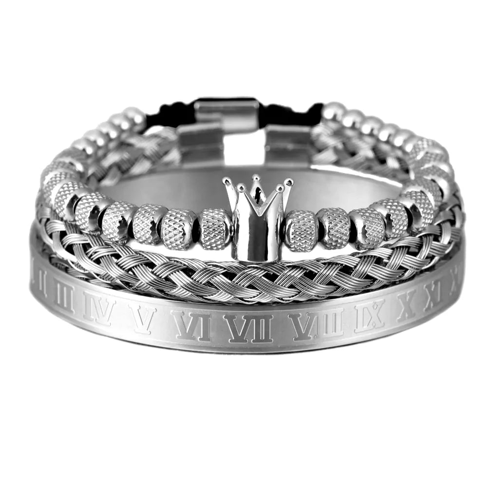 Silver bracelet set with multiple strands, featuring braided design, bead details, and a crown centerpiece, with Roman numeral engravings on one of the bands.