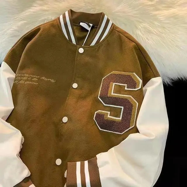 Brown and cream varsity jacket with letter patch.
