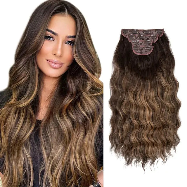 A brunette model with long, wavy hair featuring caramel-blonde highlights is shown next to a matching clip-in hair extension piece with a layered clip base and soft waves.