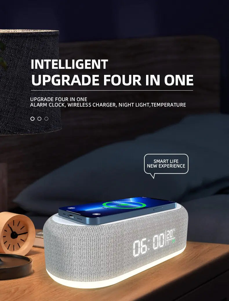 Promotional image of a fabric-covered bedside alarm clock with a glowing base and digital display reading “06:00” and “23°C,” with a smartphone charging on top; text reads “Intelligent Upgrade Four in One” and lists alarm clock, wireless charger, night light, and temperature.