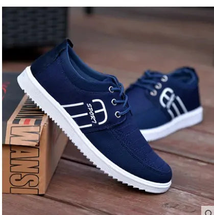 Navy blue casual lace-up sneakers with white side stripe detail, low-top canvas-style upper, and white ridged rubber soles.