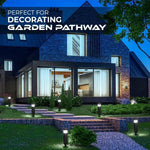 Nighttime view of a modern house with a landscaped garden pathway lit by small bollard lights; text overlay reads “Perfect for decorating garden pathway.