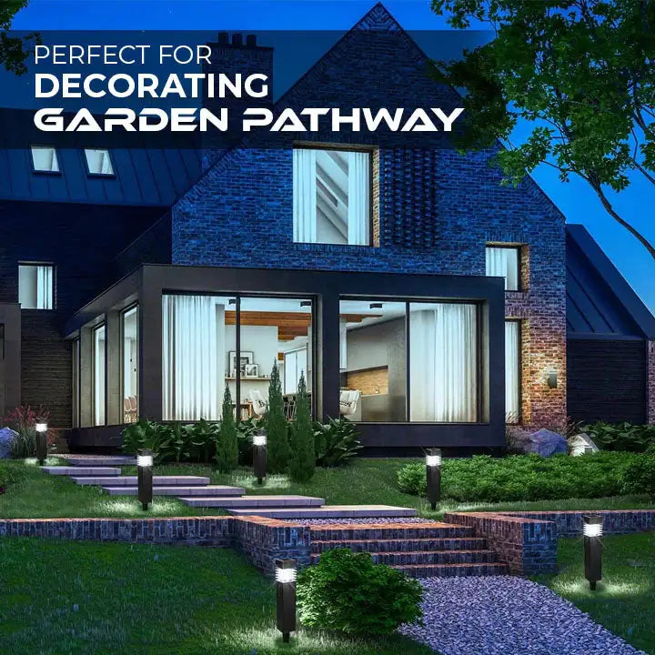 Nighttime view of a modern house with a landscaped garden pathway lit by small bollard lights; text overlay reads “Perfect for decorating garden pathway.