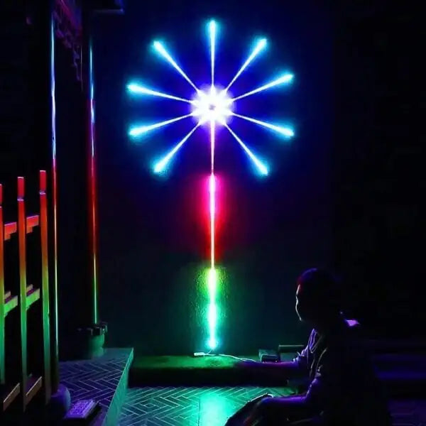 Colourful LED firework wall light with starburst display.
