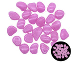 Scattered set of small smooth pink oval pebbles on a white background, with a small inset showing the same pebbles grouped together.

