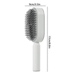 The image depicts a white hairbrush with a sleek, rectangular shape. The brush has plastic bristles and a small handle, with the dimensions of 9cm (3.5in) in width and 17cm (6.6in) in height.